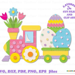 Puede incluir: Un tren de juguete rosa y amarillo con una maceta en la parte superior y tres huevos de Pascua en la parte posterior. El tren tiene lunares y los huevos están decorados con lunares y rayas.