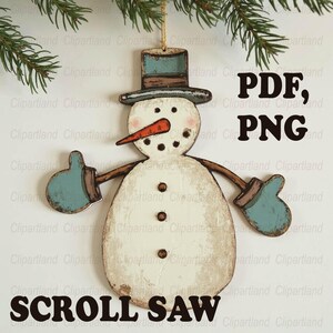 May include: Wooden snowman ornament with a distressed finish. The snowman has a carrot nose, a blue hat and mittens, and brown stick arms. The text "PDF, PNG" and "SCROLL SAW" are visible.