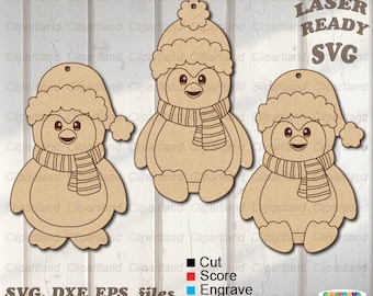 May include: Three wooden penguin ornaments with winter hats and scarves. The penguins are in different poses, with one sitting and two standing. The image includes the text "LASER READY SVG" and file type information.