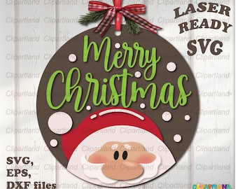 May include: A brown circle with the text "Merry Christmas" in green letters. A Santa Claus face is at the bottom of the circle. The circle is decorated with white dots. The image is labeled "Laser Ready SVG".