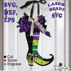 May include: A decorative witch boot door hanger with a black boot, green and purple accents, and a bow. The boot has a black heel and toe, with a green and yellow striped leg. The image includes the text "SVG, DXF, EPS" and "LASER READY SVG".