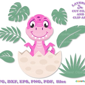 May include: A pink dinosaur hatching from a white egg with green leaves around it. The dinosaur has big eyes and a toothy smile. The text "LAYERED CUT FILES AND CLIP ART" is in purple text above the dinosaur. The text "SVG, DXF, EPS, PNG, PDF, files" is in purple text below the dinosaur. The text "CLIPARTLAND" is in purple text in the bottom right corner.