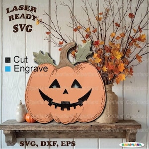 May include: A wooden pumpkin decoration with a carved jack-o'-lantern face. The pumpkin is orange with a brown stem and green leaves. The image includes the text "LASER READY SVG" and "SVG, DXF, EPS".