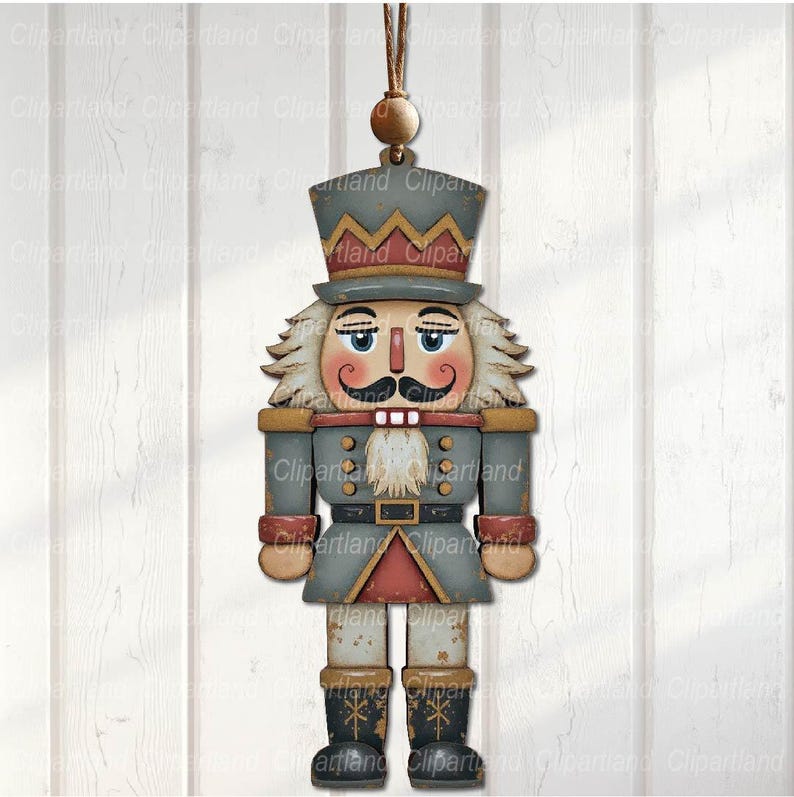 May include: A wooden Christmas ornament shaped like a nutcracker soldier. The ornament features a gray coat, a red and gold trim, and a black hat. The nutcracker has a white beard and mustache, and is hanging from a brown string.