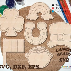 Puede incluir: Recortes de madera con temática del Día de San Patricio, que incluyen un trébol de cuatro hojas, un arcoíris, una herradura, un sombrero de duende, una bandera irlandesa y una olla de oro. La imagen también incluye el texto "LASER READY SVG" y "SVG, DXF, EPS".