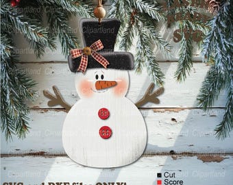 May include: A white wooden snowman ornament with a black top hat, red buttons, and a carrot nose. The snowman is against a white wood background with a green pine branch in the top right corner. The text "SVG and DXF files ONLY!" is at the bottom of the image.