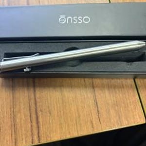 May include: A silver-toned metal bolt-action pen with a pocket clip, resting inside a black rectangular presentation box. The box lid features the white text "ensso" printed on the top surface, and the pen sits in a black foam insert.