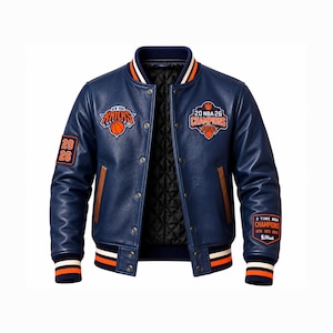 May include: A navy blue varsity jacket featuring orange and white striped ribbed cuffs and collar. The front displays a New York Knicks logo and a 20 NBA 26 Champions patch. The sleeves include 20 26 and 3 Time NBA Champions patches.