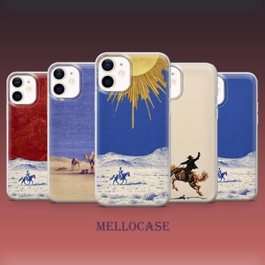 May include: Five smartphone cases arranged in a row, each featuring distinct desert-themed illustrations. Designs include a red background with a rider, a tan desert scene with camels, a blue sky with a golden sun, a rider on a horse, and a blue landscape.
