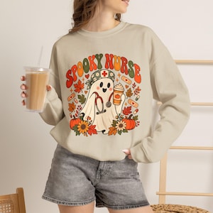 Spooky Nurse Sweatshirt, Retro Ghost RN Halloween Pullover (50% Cotton Blend)