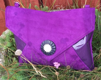 Clutch bag made from soft calf&#39;s suede and lacquered leather