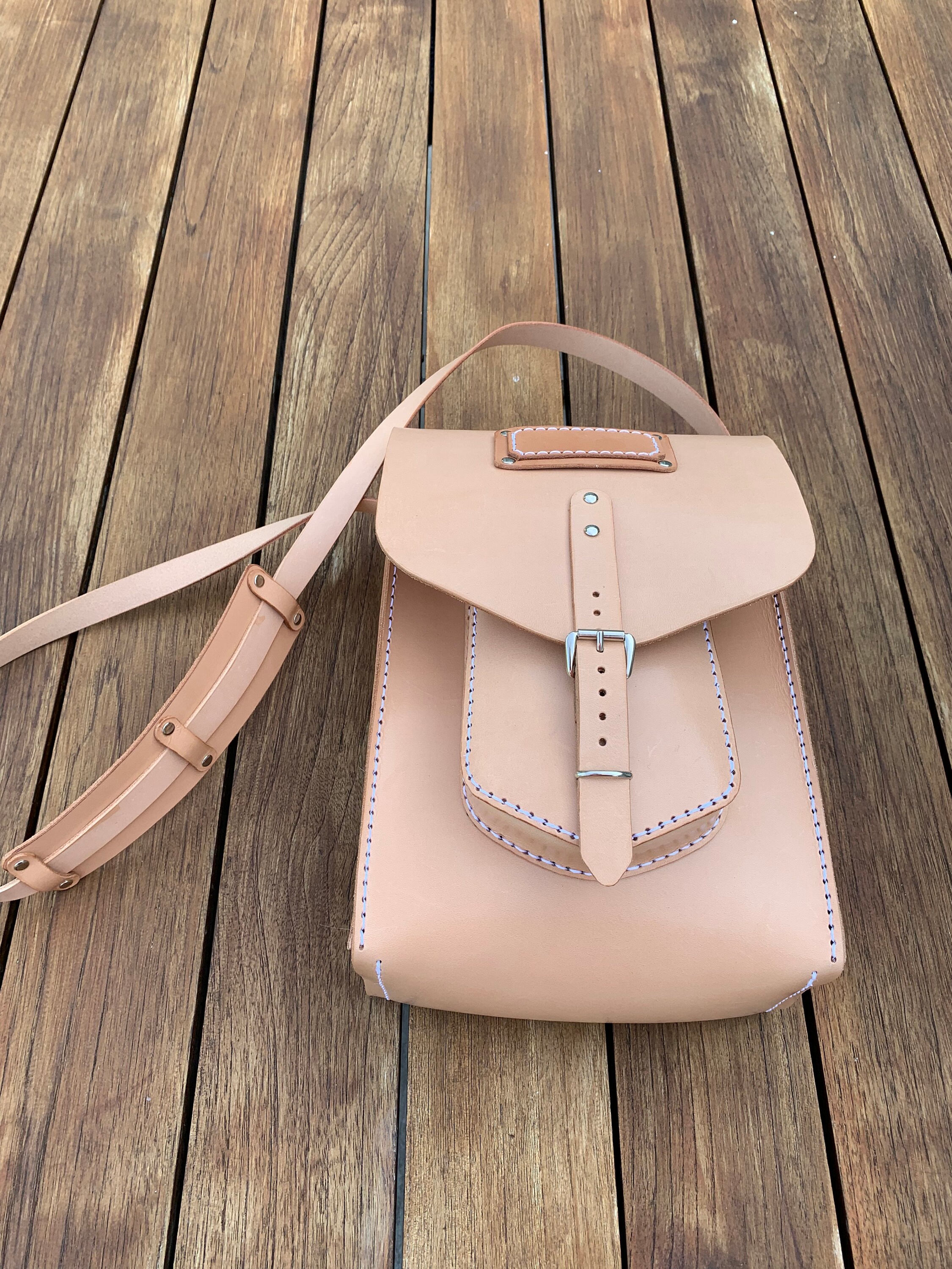 Leather messenger bag sewn by hand