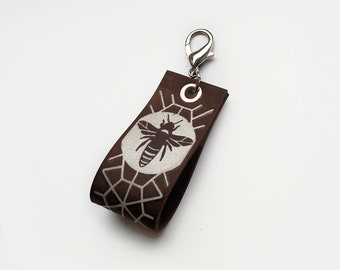 Reflective leather key chain with bee image and lobster clasp