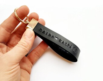 Personalized leather keychain with names, heart and date. Black custom natural leather key fob