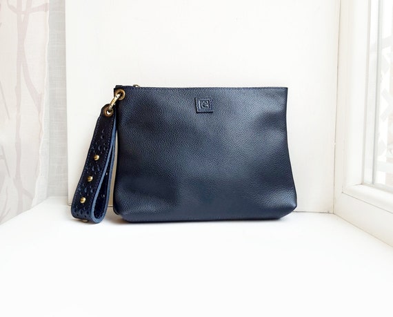 Navy clutch bag with wrist best sale strap