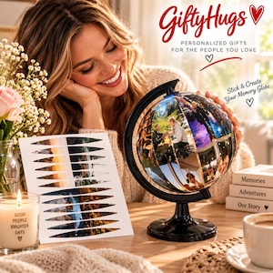 May include: A black globe stand holding a spherical memory globe covered in custom photo stickers. Beside it, a sheet of die-cut photo stickers, a candle with the text Good People Brighter Days, and stacked blocks labeled Memories, Adventures, Our Story.