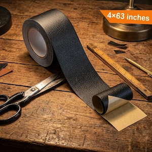 May include: A roll of black adhesive tape with a textured surface, measuring 4x63 inches. The tape is partially unrolled, revealing a tan backing paper. A pair of metal scissors, a wooden ruler, and a metal pen are positioned nearby.