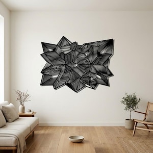 May include: A large black wall art piece featuring a complex geometric pattern of intersecting lines and angular shapes. The design consists of multiple layered, star-like clusters with varying densities of thin, parallel black lines.