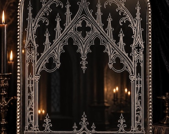 May include: An arched wall mirror featuring an intricate white etched design of pointed gothic architectural arches and trefoil motifs. The mirror has a metallic frame with a beaded border and an ornate decorative crest at the top centre.