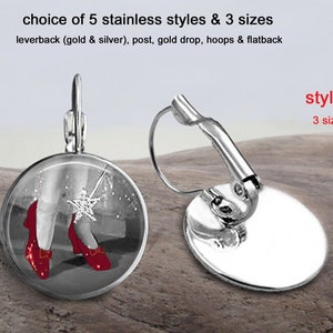 May include: Silver leverback earrings with a round glass cabochon featuring a black and white image of Dorothy's ruby slippers from the Wizard of Oz. The text "style 1" and "3 sizes" is visible in the image.