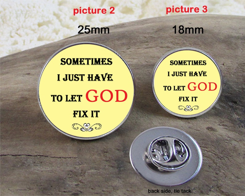 May include: A yellow and silver pinback button with the text "Sometimes I just have to let God fix it". The button is 25 mm in diameter. The back of the button is silver and has a tie tack.