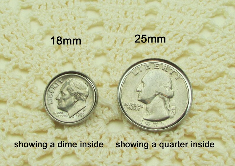May include: Two silver coins, a dime and a quarter, are shown inside two different sized silver-toned metal hoops. The hoops are 18mm and 25mm in diameter.