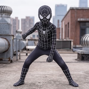 May include: A full-body black spandex costume featuring a white spider web pattern across the entire suit, including the mask and gloves. A large white spider emblem is centered on the chest, and the mask includes white eye lenses.