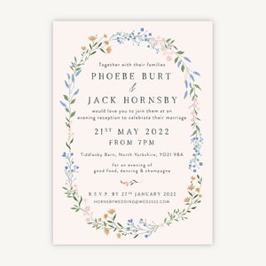 May include: A floral wedding invitation with a pink background. The invitation features a wreath of flowers and leaves with the names "Phoebe Burt" and "Jack Hornsby" in a script font. The date of the wedding is "21st May 2022" and the time is "From 7pm". The location is "Tiddlesby Barn, North Yorkshire, YO21 9BA". The invitation also includes the RSVP information: "R.S.V.P. by 27th January 2022" and the website address "hornsbywedding@wed2022.com".