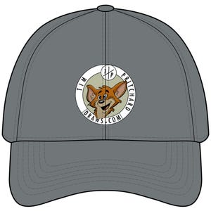 May include: A grey baseball cap featuring a circular logo on the front. The logo contains a cartoon illustration of a brown cat face and the text "TIM PRITCHARD DRAWS.COM" along the border, with a small "T/P" emblem at the top centre.