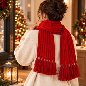 May include: A bright red knitted scarf featuring a thick ribbed texture and long, dangling tassels at both ends. The scarf is wrapped around the neck and draped over the shoulders, showcasing a consistent vertical knit pattern throughout the fabric.