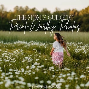 May include: A digital guide titled THE MOM'S GUIDE TO Print-Worthy Photos, Learn your camera. Capture their childhood. The cover features a child with long hair running through a field of white daisies and green grass, wearing a white top and pink skirt.