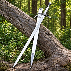 May include: A silver-toned metal sword with a white handle and a matching white scabbard. The sword features a pointed blade, a crossguard with dark accents, and a pommel. The scabbard has silver-toned metal fittings at the tip and the opening.