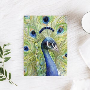 May include: Watercolor painting of a peacock with a blue head and neck, and a green, blue, and gold tail. The peacock's head is turned to the side, and its eye is visible.