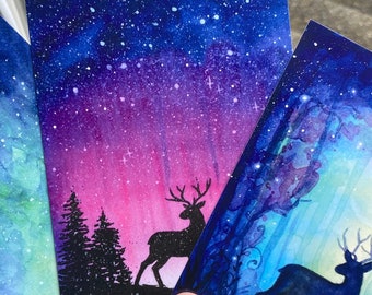 Juego de postales navideñas de renos en acuarela, papelería de cuento de hadas invernal.