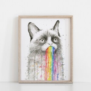May include: A watercolor painting of a grumpy cat with a rainbow coming out of its mouth. The cat is drawn in shades of gray, while the rainbow is a vibrant mix of colors.