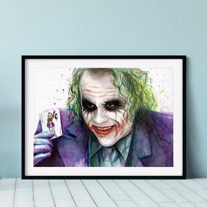 May include: A watercolour painting of the Joker from the film "The Dark Knight". He is holding a playing card with the Joker on it and has a sinister smile on his face.