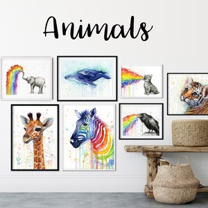 May include: A set of eight watercolor paintings featuring various animals, each with a rainbow emanating from their mouths. The animals include a giraffe, zebra, elephant, whale, cat, crow, and tiger. The word "Animals" is written in black cursive at the top of the image.