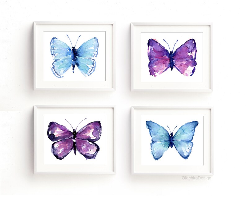 May include: Set of four watercolor paintings of butterflies. Two butterflies are blue and two are purple.