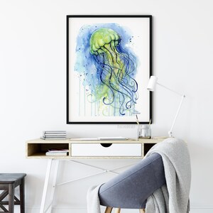 May include: Watercolor painting of a green jellyfish with blue tentacles on a blue and green background.