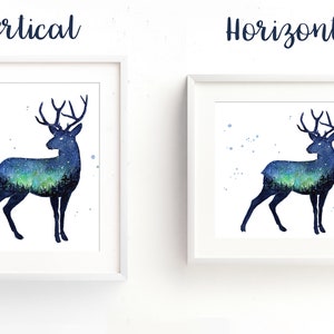 May include: A watercolor painting of a deer silhouette with a starry night sky and aurora borealis inside the silhouette. The painting is framed in a white frame and is shown in both vertical and horizontal orientations.