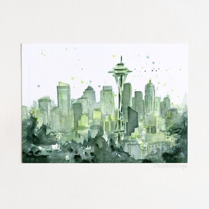 May include: Watercolor painting of a cityscape in shades of green and gray. The Space Needle is the focal point, with other buildings in the background. The artwork has a soft, artistic feel, with splatters of green paint.