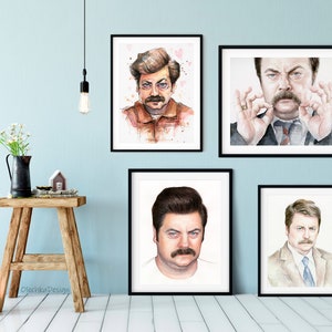 May include: Four framed watercolor paintings of a man with a mustache. The man is depicted in different poses and expressions. The paintings are all in black frames and are hanging on a light blue wall.