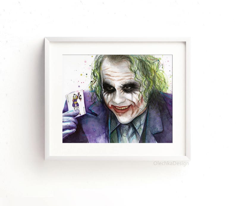 May include: A watercolour painting of the Joker from the film The Dark Knight. He is holding a playing card with the Joker on it. The painting is done in shades of purple, green, and white.