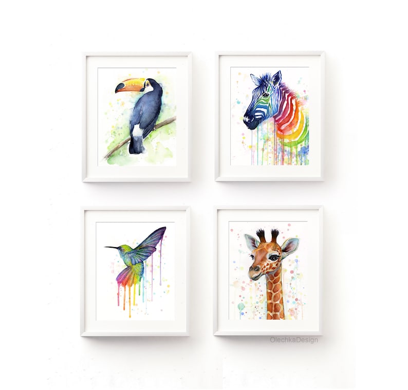 May include: Set of four watercolor animal prints featuring a toucan, zebra, hummingbird, and giraffe. Each animal is depicted with a colorful watercolor background and paint splatters.