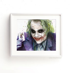 May include: Watercolor painting of the Joker from the movie The Dark Knight. He is holding a playing card with a Joker on it. The background is white with colorful splatters.