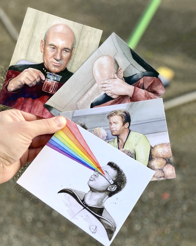 May include: Four watercolor illustrations of Star Trek characters. The first shows Captain Picard drinking tea, the second shows Captain Picard with his hand over his eyes, the third shows a character with a rainbow emanating from their eyes, and the fourth shows a character with a rainbow emanating from their eyes.