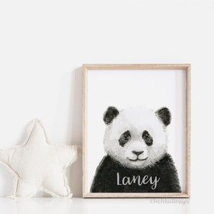 May include: Black and white watercolour illustration of a panda bear with the name "Laney" written below. The illustration is framed in a light wood frame.