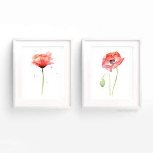 May include: Two watercolor paintings of red poppies. The first painting shows a single poppy with a green stem and leaves. The second painting shows a poppy with a bud and a green stem and leaves.