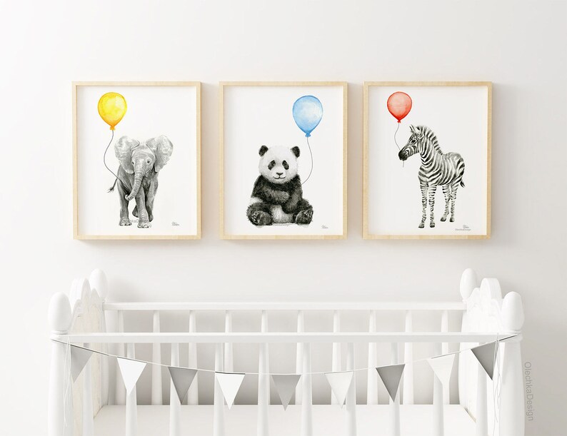 May include: Three framed black and white illustrations of animals with balloons. The first illustration shows an elephant with a yellow balloon. The second illustration shows a panda with a blue balloon. The third illustration shows a zebra with a red balloon.