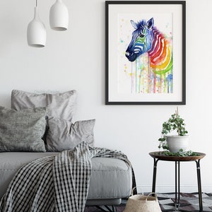 May include: A watercolor painting of a zebra with a rainbow pattern. The zebra is facing to the left and has a white background with colorful water droplets.